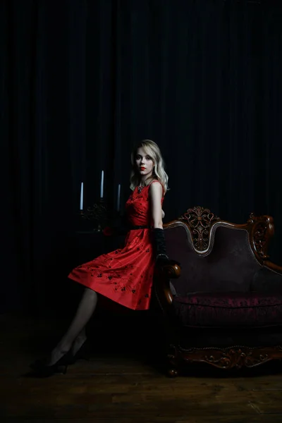 Beautiful Girl Red Dress Posing Armchairs Waiting Black Background — Stock Photo, Image