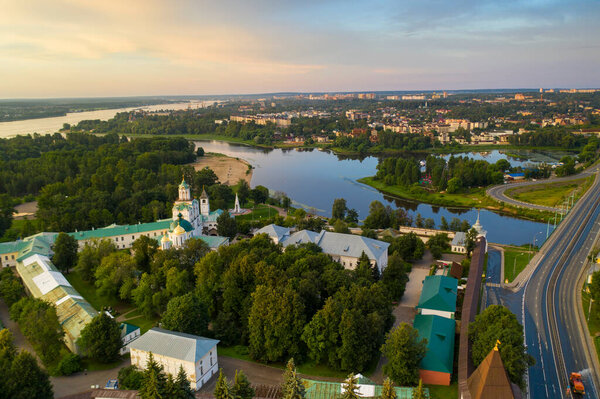 a panoramic view of the old fortress and church in the early morning at dawn filmed from a drone