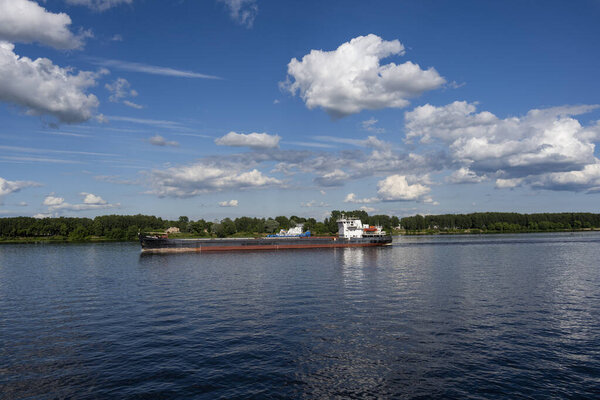 river embankment with buildings and a park