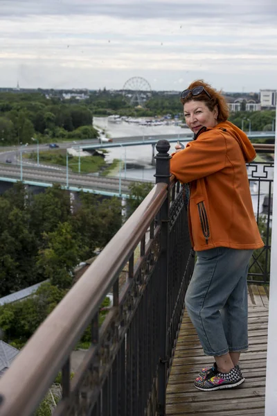 Woman Orange Sweater Admires Panoramic Views City Observation Deck Tall — Stock Photo, Image