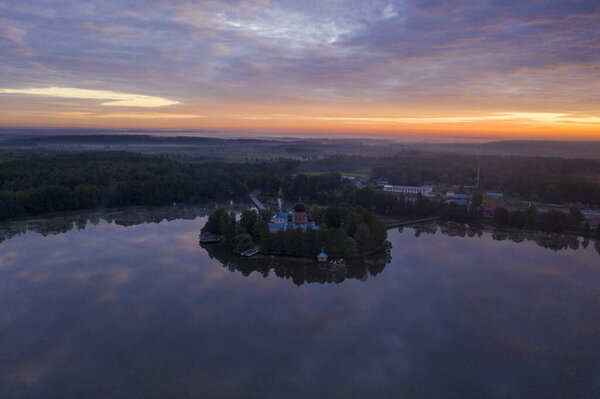 island ancient monastery in the middle of the lake at sunrise