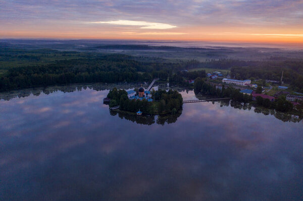 island ancient monastery in the middle of the lake at sunrise