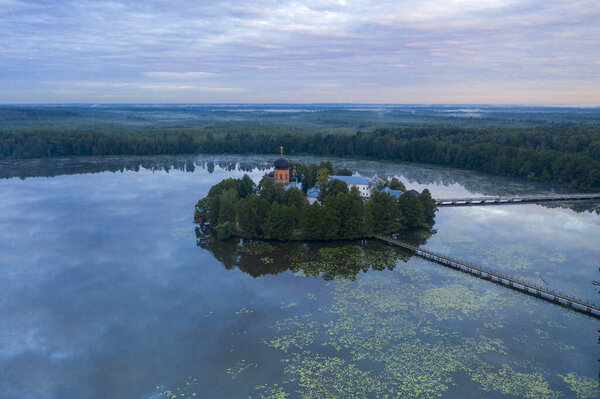 island ancient monastery in the middle of the lake at sunrise