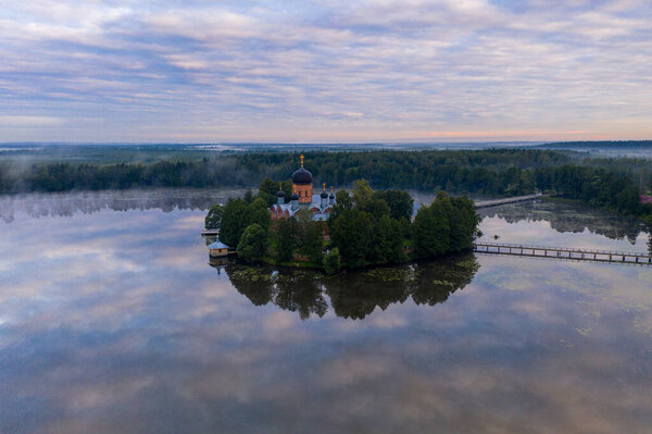 island ancient monastery in the middle of the lake at sunrise