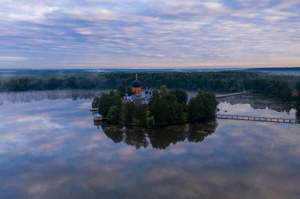 island ancient monastery in the middle of the lake at sunrise