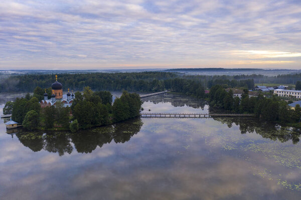 island ancient monastery in the middle of the lake at sunrise