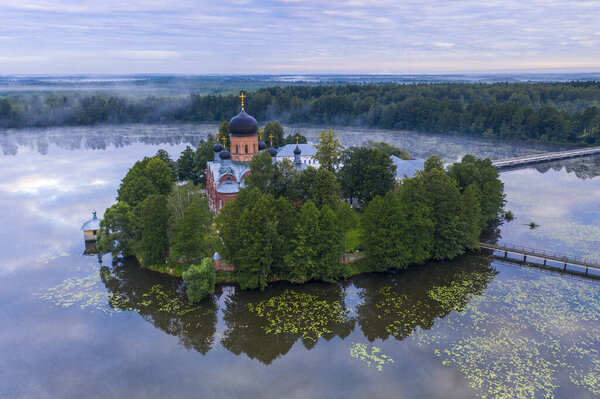 island ancient monastery in the middle of the lake at sunrise