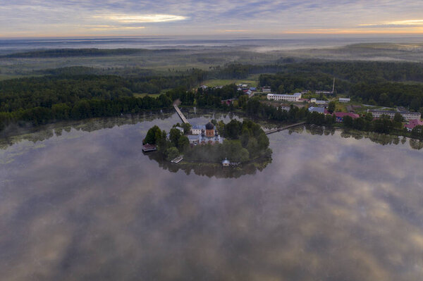 island ancient monastery in the middle of the lake at sunrise