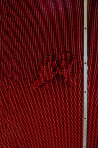 little girl's imprint on a red soft surface