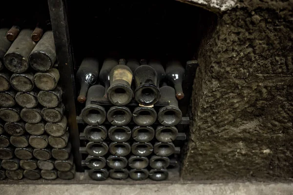 old bottles with wine stored in special cellars and stored using special technology