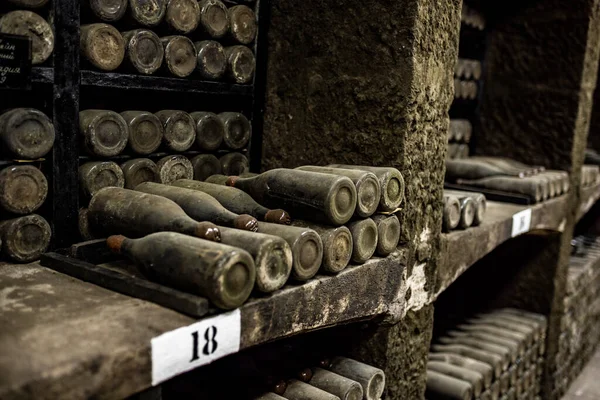 old bottles with wine stored in special cellars and stored using special technology