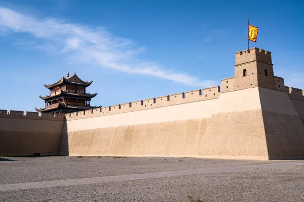 The majestic Jiayuguan City watchtower in Gansu Province, China. Chinese characters on black plaque: Place names of Jiayuguan.The majestic Jiayuguan Great Wall Corner Tower in Gansu Province, China.The turret of the Great Wall in Jiayuguan