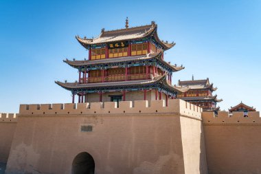 The majestic Jiayuguan City watchtower in Gansu Province, China. Chinese characters on black plaque: Place names of Jiayuguan.The majestic Jiayuguan Great Wall Corner Tower in Gansu Province, China.The turret of the Great Wall in Jiayuguan clipart