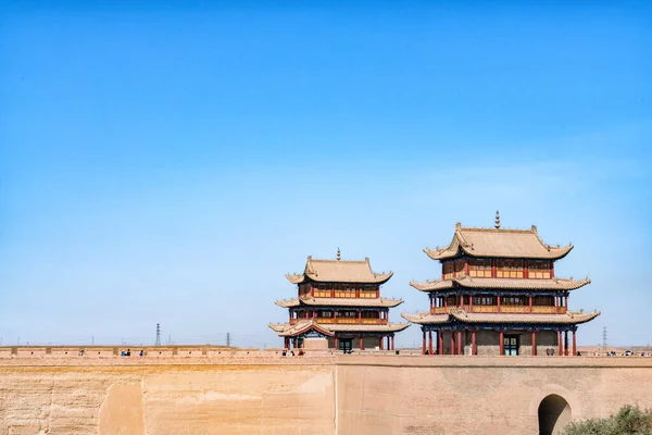 The majestic Jiayuguan City watchtower in Gansu Province, China. Chinese characters on black plaque: Place names of Jiayuguan.The majestic Jiayuguan Great Wall Corner Tower in Gansu Province, China.The turret of the Great Wall in Jiayuguan