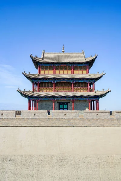 The majestic Jiayuguan City watchtower in Gansu Province, China. Chinese characters on black plaque: Place names of Jiayuguan.The majestic Jiayuguan Great Wall Corner Tower in Gansu Province, China.The turret of the Great Wall in Jiayuguan