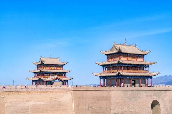 The majestic Jiayuguan City watchtower in Gansu Province, China. Chinese characters on black plaque: Place names of Jiayuguan.The majestic Jiayuguan Great Wall Corner Tower in Gansu Province, China.The turret of the Great Wall in Jiayuguan