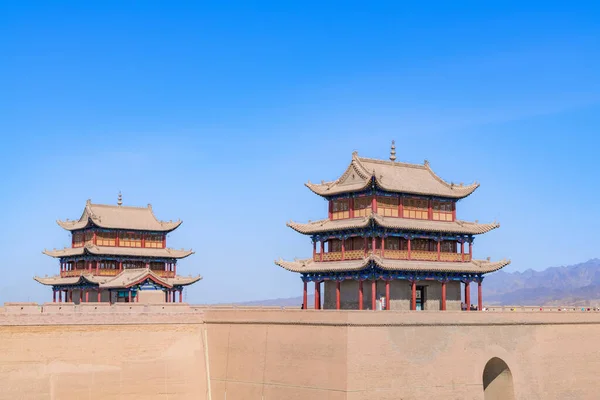 The majestic Jiayuguan City watchtower in Gansu Province, China. Chinese characters on black plaque: Place names of Jiayuguan.The majestic Jiayuguan Great Wall Corner Tower in Gansu Province, China.The turret of the Great Wall in Jiayuguan