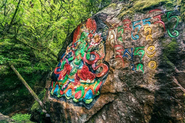 Tibetan murals in the stone wall carvings of Dongga Temple, Hailuogou, Sichuan, China, Thangka, rock carving