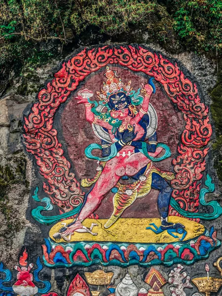 Tibetan murals in the stone wall carvings of Dongga Temple, Hailuogou, Sichuan, China, Thangka, rock carving