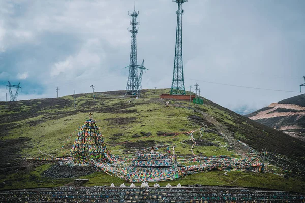 Colorful Fengma Banner in Zheduo Mountain Pass, Ganzi Prefecture, Sichuan, China.Iron tower on Zuoduo Mountain in western Sichuan