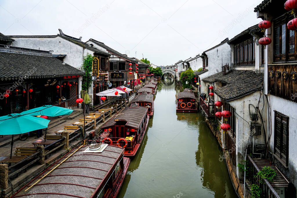 White walls and black tiles of a family in Suzhou, Jiangsu Province, China .White wall and Black tile, Shantang street, Suzhou, Jiangsu Province, China. Small bridges and flowing houses in South ChinaWhite wall and black tiles in Suzhou Garden, China