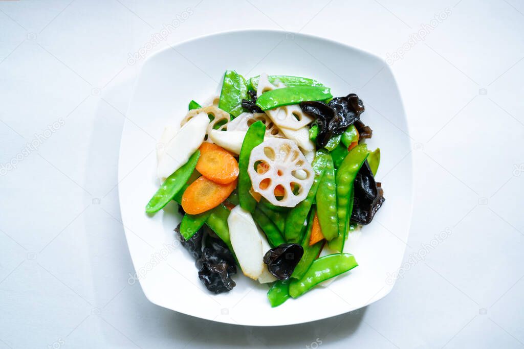 Cantonese food in Guangdong, China: stir fry in lotus pond. Stir fried vegetables in lotus pond, Guangdong Province, China