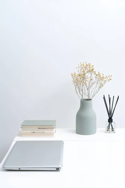 Working at home in a minimalist home. Dining tables and chairs and furnishings in a minimalist modern home.