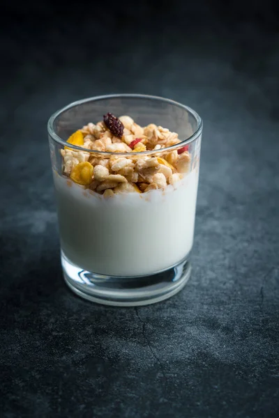 A cup of western-style breakfast oatmeal yogurt.A glass of western breakfast oatmeal milk