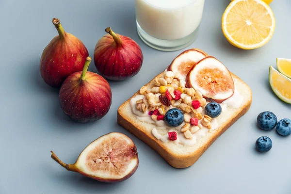 A healthy western breakfast with figs and toast and oatmeal.A western breakfast with fruit and milk