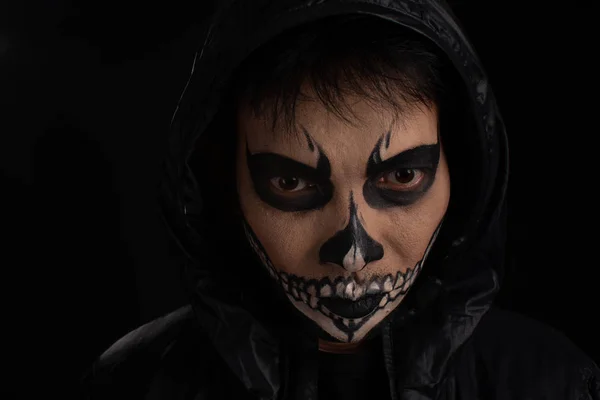 Southeast asian man with skull face makeup on black background, — Stock Photo, Image