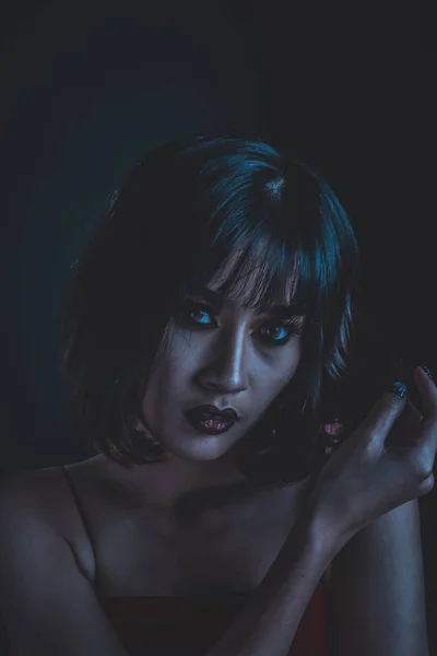 Woman with makeup in dark tone image