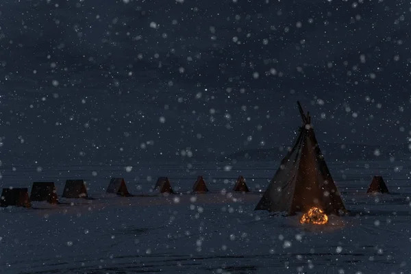 Winter snowfall and camping tent with bonfire, night light photo