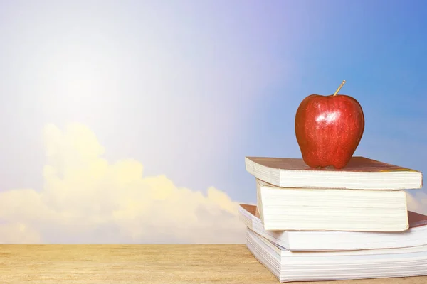 Red Apple Book Clouds Sky Background Wood Table Education Concept — Stock Photo, Image