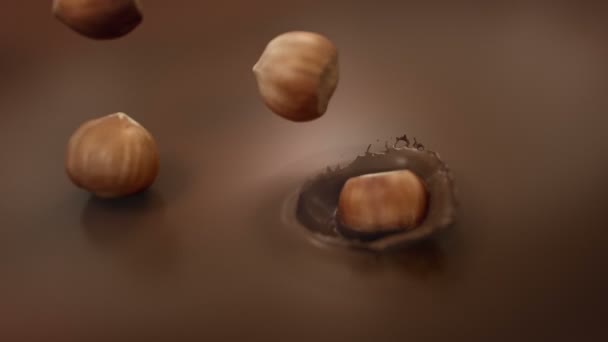 Φουντούκια Πιτσιλίζουν Υγρή Σοκολάτα Γάλακτος Super Αργή Κίνηση — Αρχείο Βίντεο
