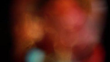 Nettipattam, arka plan için soyut bokeh siyah arkaplanı bulanıklaştırdı, parlayan parlak bokeh dağıldı ve altın ışıltılar arka planda.