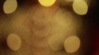 Nettipattam, arka plan için soyut bokeh siyah arkaplanı bulanıklaştırdı, parlayan parlak bokeh dağıldı ve altın ışıltılar arka planda.