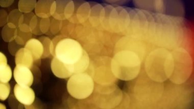 Nettipattam, arka plan için soyut bokeh siyah arkaplanı bulanıklaştırdı, parlayan parlak bokeh dağıldı ve altın ışıltılar arka planda.