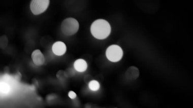 arkaplan için siyah ve beyaz bulanık bokeh siyah arkaplan, parlayan parlak bokeh dağılmış ve parlayan arkaplan.