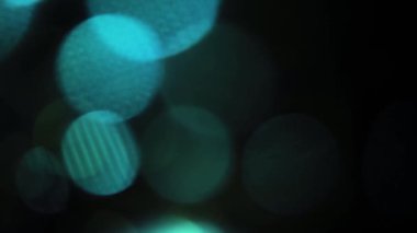 Nettipattam, arka plan için soyut bokeh siyah arkaplanı bulanıklaştırdı, parlayan parlak bokeh dağıldı ve altın ışıltılar arka planda.