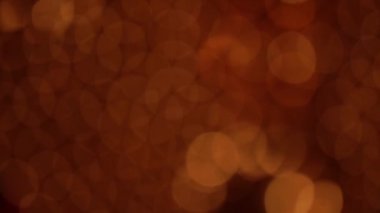Nettipattam, arka plan için soyut bokeh siyah arkaplanı bulanıklaştırdı, parlayan parlak bokeh dağıldı ve altın ışıltılar arka planda.