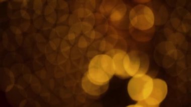 Nettipattam, arka plan için soyut bokeh siyah arkaplanı bulanıklaştırdı, parlayan parlak bokeh dağıldı ve altın ışıltılar arka planda.