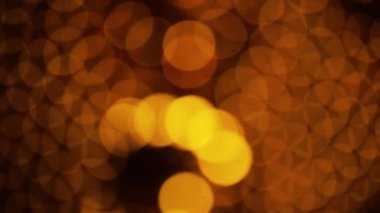 Nettipattam, arka plan için soyut bokeh siyah arkaplanı bulanıklaştırdı, parlayan parlak bokeh dağıldı ve altın ışıltılar arka planda.