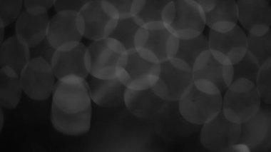 arkaplan için siyah ve beyaz bulanık bokeh siyah arkaplan, parlayan parlak bokeh dağılmış ve parlayan arkaplan.