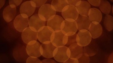 Nettipattam, arka plan için soyut bokeh siyah arkaplanı bulanıklaştırdı, parlayan parlak bokeh dağıldı ve altın ışıltılar arka planda.