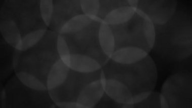 arkaplan için siyah ve beyaz bulanık bokeh siyah arkaplan, parlayan parlak bokeh dağılmış ve parlayan arkaplan.