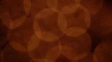 Nettipattam, arka plan için soyut bokeh siyah arkaplanı bulanıklaştırdı, parlayan parlak bokeh dağıldı ve altın ışıltılar arka planda.