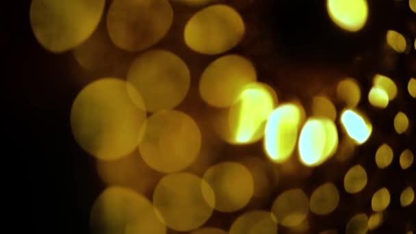 Nettippattamは背景のための抽象的なボケ黒の背景をぼかした 輝く明るいボケと黄金の輝きの背景 — ストック動画