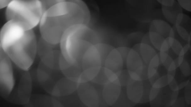 fond noir et blanc abstrait flou bokeh noir pour toile de fond, bokeh lumineux scintillant déconcentré et fond scintillant.