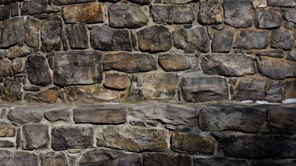 Texture del muro di pietra invecchiata scura — Foto Stock
