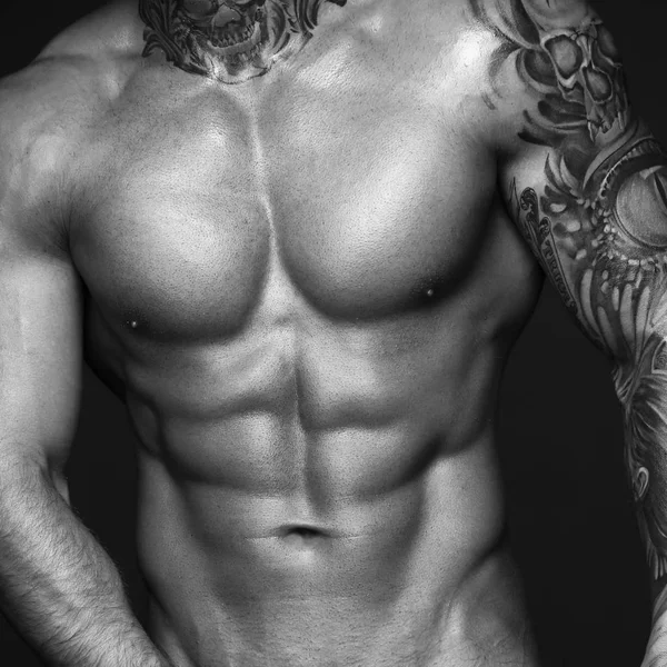 Body part image. Black and white contast photo of sexy mans muscular body. Sexi male model. Hot macho, bodybuilder with muscle torso in abs poses. 1 in 1 crop — Stock Photo, Image